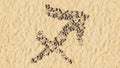 Stones on beach sand handmade symbol shape, golden sandy background, sagittarius zodiac sign Royalty Free Stock Photo