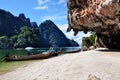 Stones, beaches and boats where the sea meets, Phuket, Thailand.