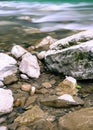 Stones and boulders close-up on a mountain river stream in the background. The Hosta river in yew-boxwood grove park in Sochi, Royalty Free Stock Photo