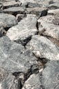 stones boulders are huge piled up in close-up gray