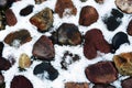 Stones covered by the snow. Abstract winter background. Royalty Free Stock Photo