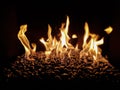 Stones in fireplace with flames Royalty Free Stock Photo
