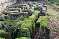 Stones found and placed by archeologists at the ancient site of Olympia on the Peloponnese peninsula in Southern Greece overgrown