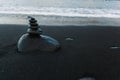 Stones Heap Built Tower on Beach Wet Sand and Sea Royalty Free Stock Photo