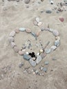 Stones heart on sand