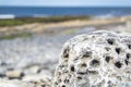 Stones with holes at storm beach by Carrowhubbuck North Carrownedin close to Inishcrone, Enniscrone in County Sligo