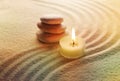 Stones and light candle Royalty Free Stock Photo