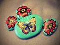 Stones with painted butterfly and flowers