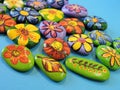 Stones with painted flowers Royalty Free Stock Photo