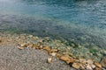 Stones on a pebble beach under water, calm on the sea. Royalty Free Stock Photo