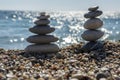 Stones and pebbles stack, harmony and balance, two stone cairns on seacoast Royalty Free Stock Photo