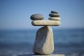 Stones pile background. Scales balance. Balanced stones on the top of boulder. Decide problem. To weight pros and cons. Royalty Free Stock Photo