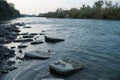 Stones on the Prut River. Stormy current. Royalty Free Stock Photo