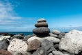 Stones pyramid on pebble beach Royalty Free Stock Photo