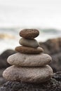 Stones pyramid on sand symbolizing zen, harmony, balance Royalty Free Stock Photo