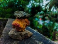 Stones pyramid on a wall with an outdoor background Royalty Free Stock Photo