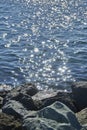 Sun sparkles dancing on blue water Royalty Free Stock Photo