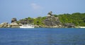 Stones and rocks paradise lagoon. White ship near big stones in lagoon. Seascape