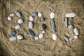 Stones on sand closeup Royalty Free Stock Photo