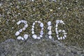 Stones on sand closeup. New Year .2016. Beach. Copy space Royalty Free Stock Photo