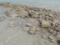 Stones and sand on Fuwairit Beach in Qatar Royalty Free Stock Photo