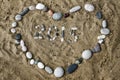 Stones on sand in shape of heart closeup Royalty Free Stock Photo