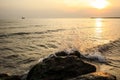 Stones in the sea on the background of the sunrise