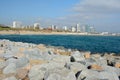 Stones, sea, beach and buildings in Barcelona in Spain Royalty Free Stock Photo