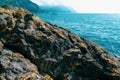 Landscape with blue sea, rocks and mountains. Rest on the sea. Royalty Free Stock Photo