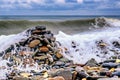 Stones on the shore against the backdrop of sea waves