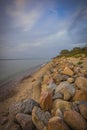 stones on the shore of the Baltic Sea after sunset Royalty Free Stock Photo