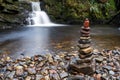 Stones stack at waterfall Royalty Free Stock Photo