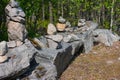 Stones stacked in a pyramid along the road. Royalty Free Stock Photo