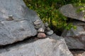 Stones stacked in a pyramid along the road. Royalty Free Stock Photo