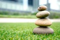 Stones stacked up on grass Royalty Free Stock Photo