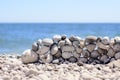 Stones stacked into a wall at the seaside Royalty Free Stock Photo