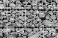 Stones in steel wire cage - gabion rock wall Royalty Free Stock Photo