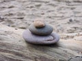 Stones tower on wood on sea coast