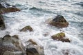 Stones with water and spray, splash. Sea coast Royalty Free Stock Photo