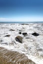 Stones in water wave black sea