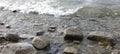 stones water waves lake grey Royalty Free Stock Photo