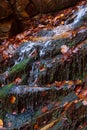 Stones waterfall reflection forest water autumn trees sun landscape yellow park leaves Royalty Free Stock Photo