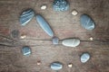 Stones on a wooden background, the concept of equilibrium The burden hours