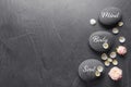 Stones with words MIND, BODY, SOUL on grey background, top view with space for text