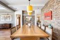 stonewalled dining room with wooden table