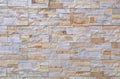 Stoneware paneling wall with natural stone bricks effect. Colors are yellow, gray and light brown Royalty Free Stock Photo