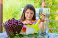 Stoning fresh cherries by young pretty girl in the garden Royalty Free Stock Photo