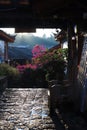 Stony balcony view in background of blooming flowers in China Royalty Free Stock Photo