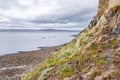 Stony beach below Lindisfarne Castle on Holy Island Royalty Free Stock Photo