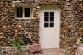 Stony designed wall with door and window Royalty Free Stock Photo